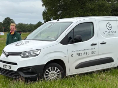 Vet Shelley pictured behind the front of the Little Rock Equine Vets van.